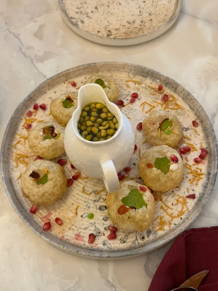 Luxury Indian fine-dining takeout at Ghazal Fine-Dine in Tamarack, Edmonton — butter chicken, tandoori chicken, afghani chaap, dal makhani, and mithai prepared for pickup